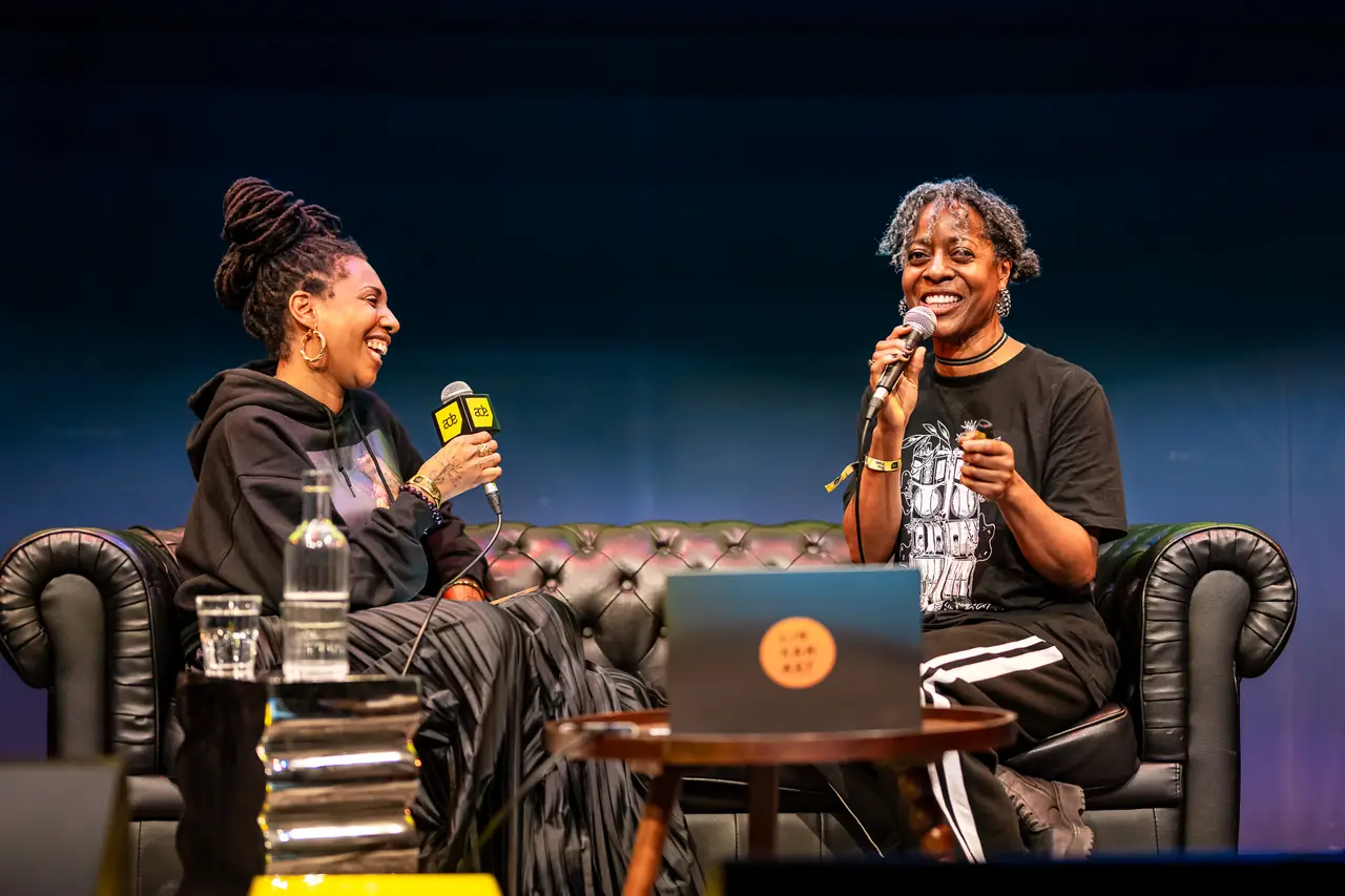Two speakers in conversation on stage at ADE 2025